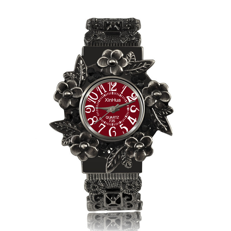 Embossed flower quartz watch