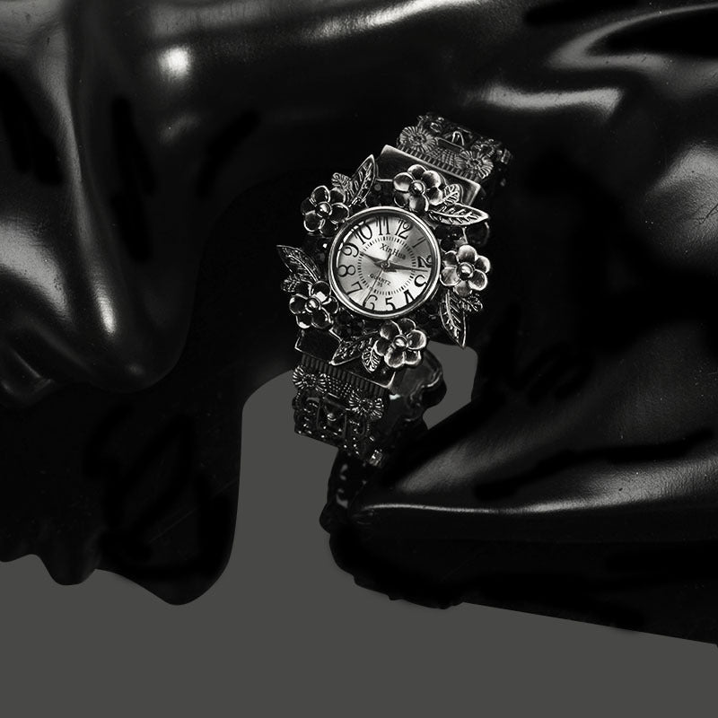 Embossed flower quartz watch