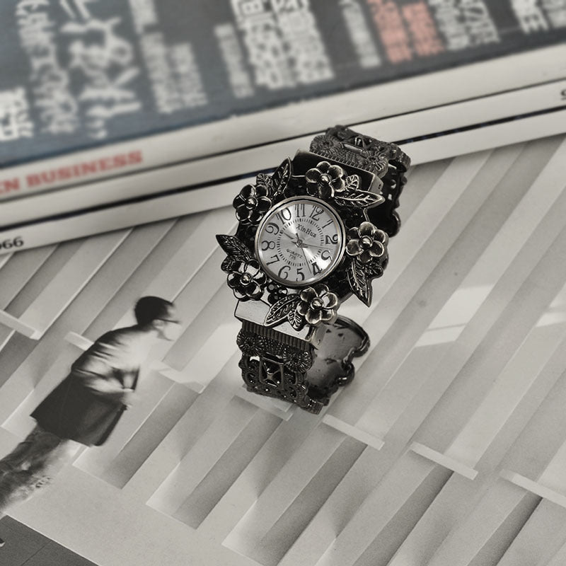 Embossed flower quartz watch