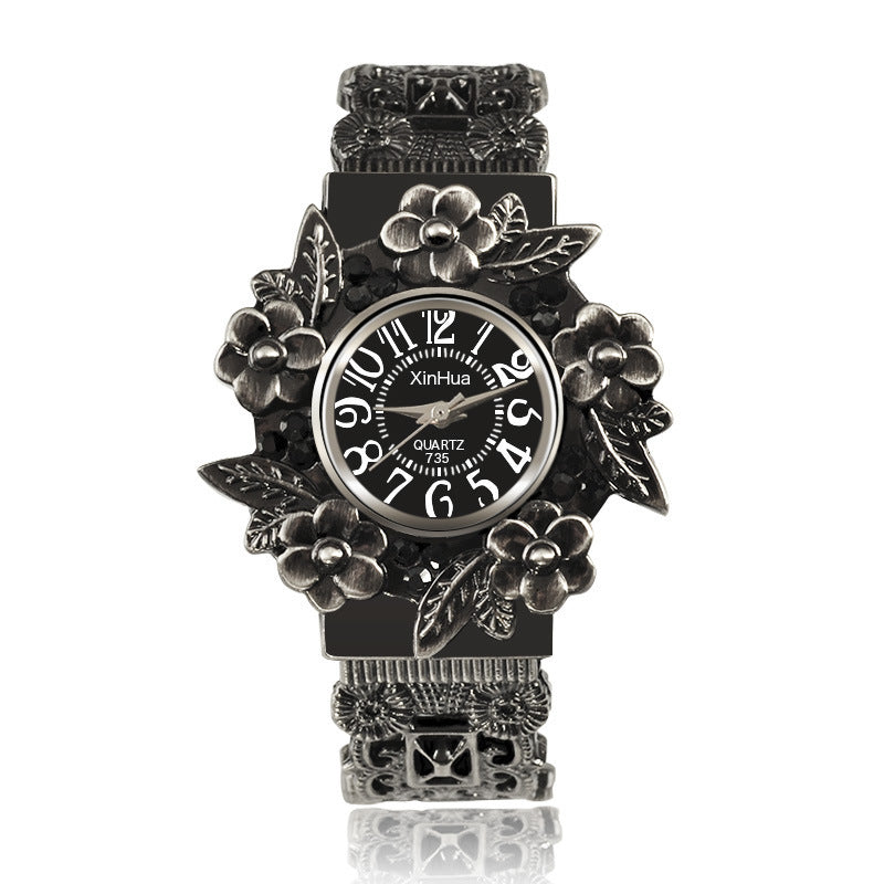 Embossed flower quartz watch