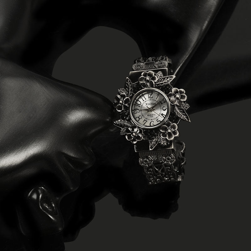 Embossed flower quartz watch