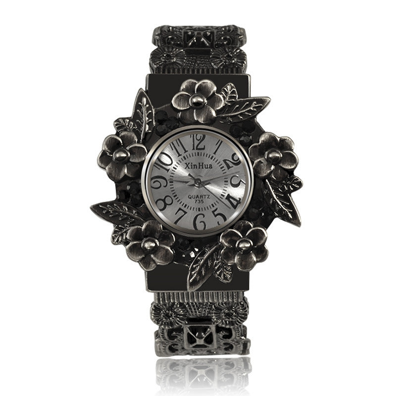 Embossed flower quartz watch